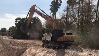 SANY SY215C Excavator And Dump Truck At Work