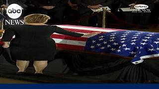 Sen. Darline Graham touches the casket of late brother Lindsey Graham