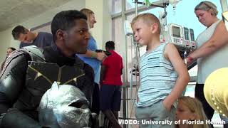 Superheroes visit UF children's hospital to brighten day of patients