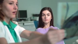 Female Dentist Explaining X-ray Image Stock Video