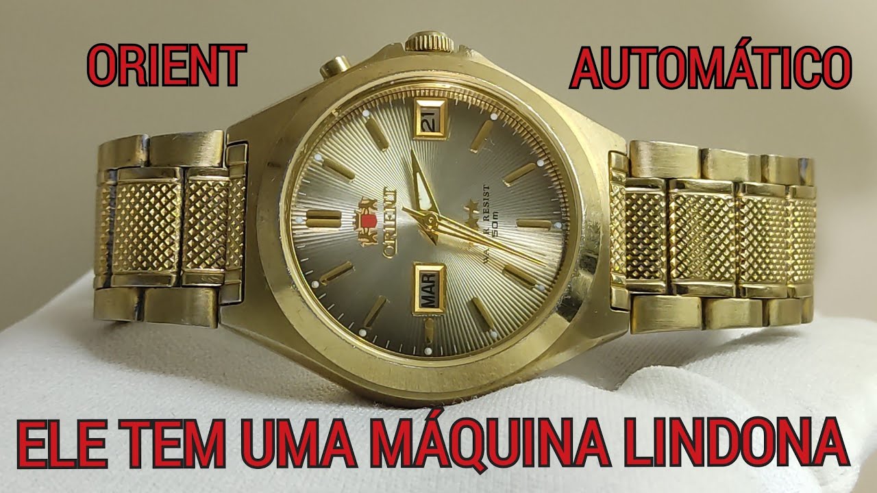 Montre Orient EM5A-CO CA Années 1970 - Automatique - Jour Et Date - Boîtier Argenté - Vintage