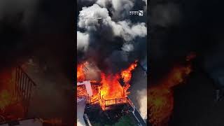 Drone footage shows violent fire ripping through Pella home