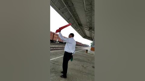 Railway staff for signal man whose flag indicates wrong