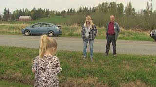 Loved ones connect across a ditch at closed US-Canada border