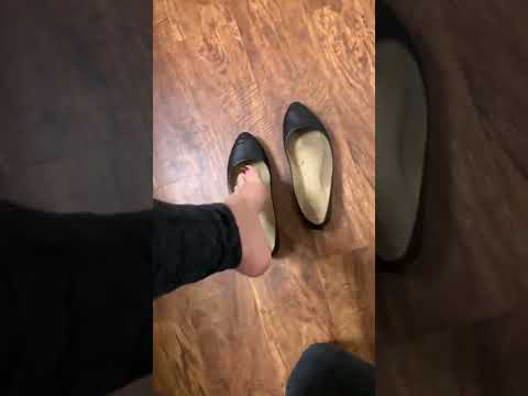 Sweaty black ballet flats with heel popping
