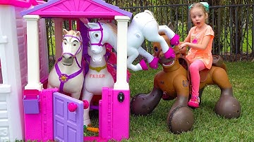 Nastya is building new houses for horses