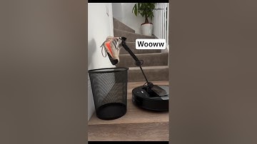 This robot vacuum helps with household chores with its robotic arm