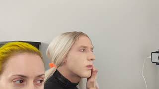 Crossdresser Putting On Foundation