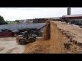 Raking and Defacing silage pile