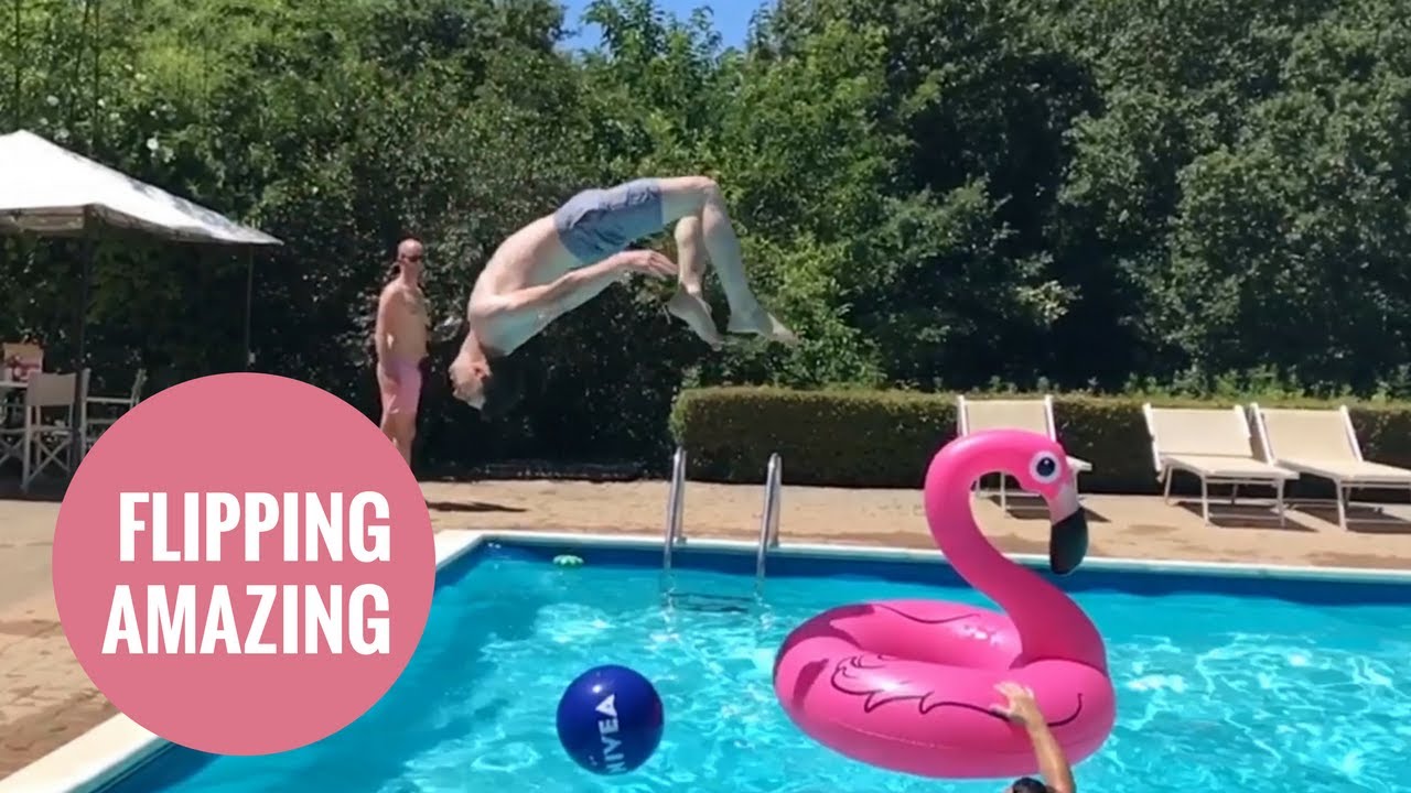 Man's amazing dive through inflatable flamingo - YouTube