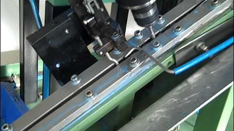 Elscint Automatic Tapping Machine with auto feeding from a Elscint Vibratory bowl feeder Model 250