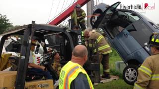 WATCH: Firefighters rescue elderly woman trapped in vehicle suspended on utility pole guy wire