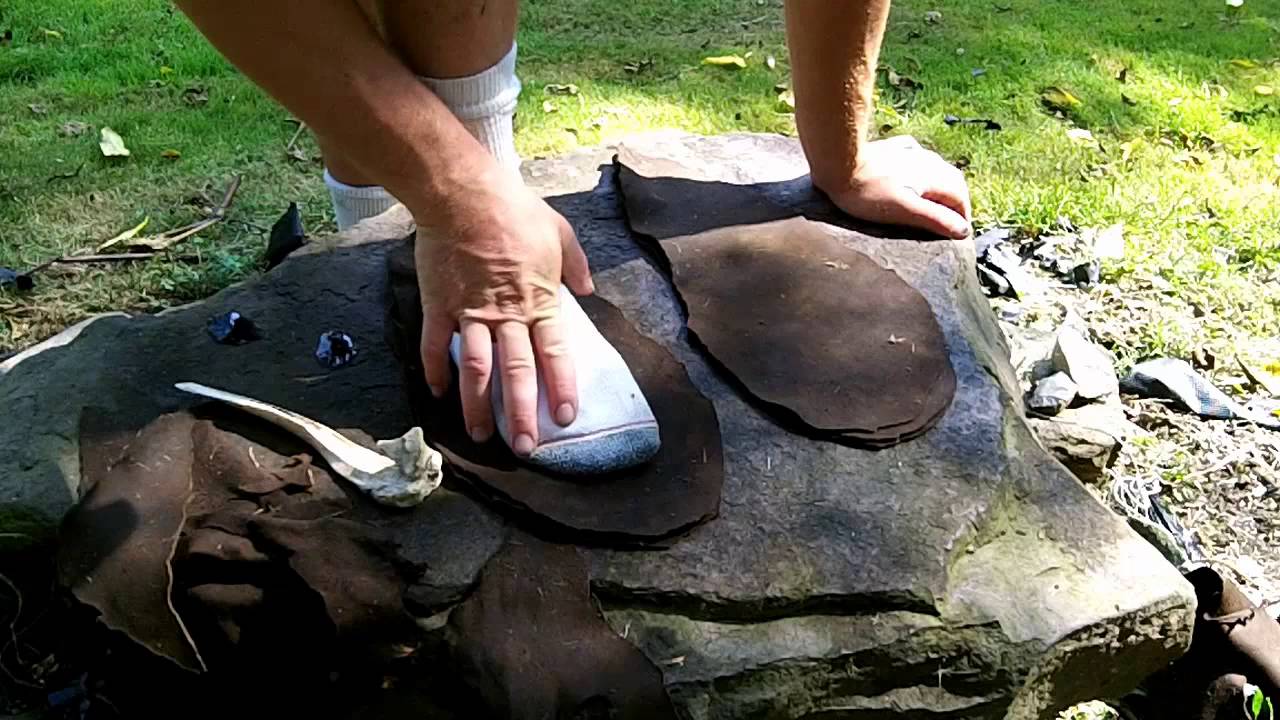 making a pair of puckered toe moccasin boots with natural primitive tools  for hunting and stalking 