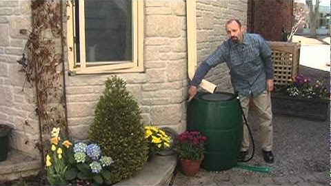 How to install and use a rain barrel (with added slow-drainage cap)