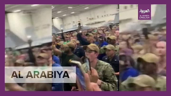 Captain Crozier cheered by sailors from USS Theodo...