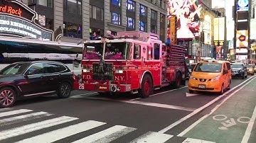FDNY ENGINE 26 TAKING UP FROM A EMS CALL ON 7TH AVENUE IN TIMES SQUARE, MANHATTAN IN NEW YORK CITY.