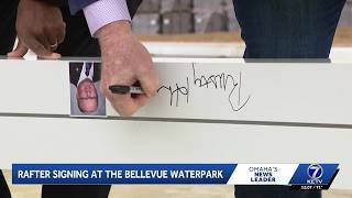 Bellevue officials sign rafters at new indoor water park