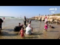 Palestinians take a holiday dip - in Israeli waters