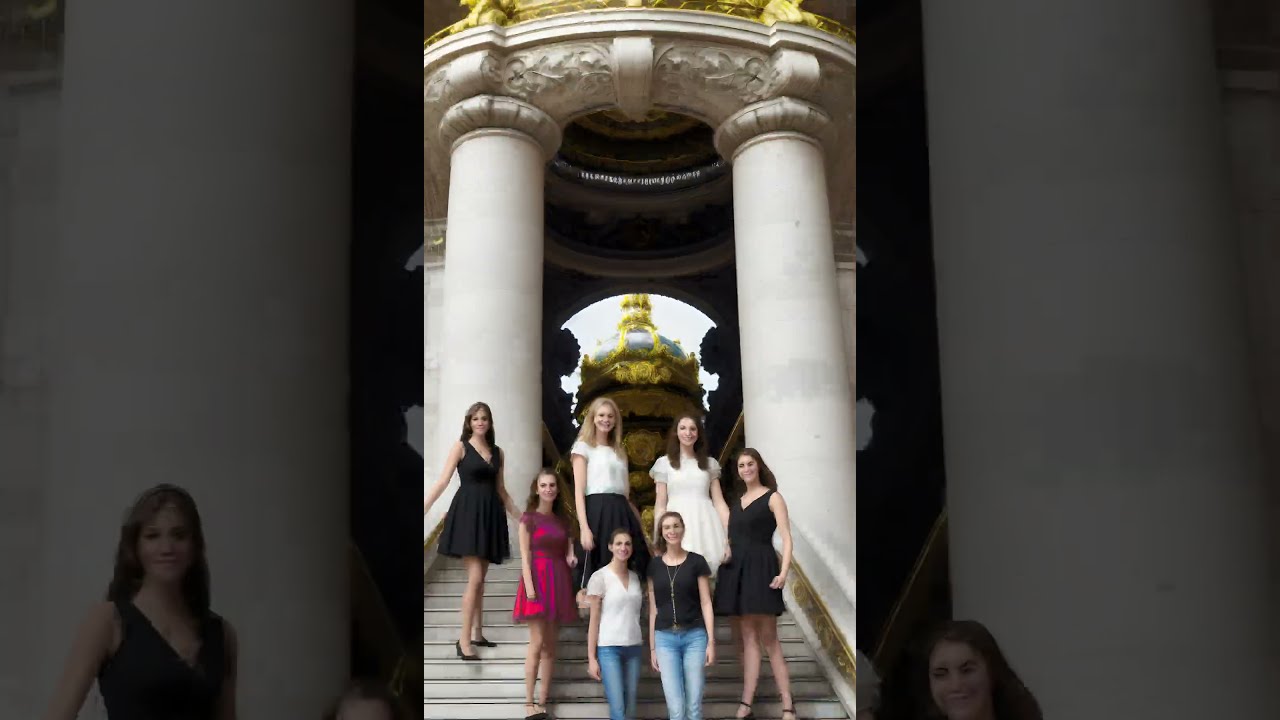 Women on the Monumental stairway of the Palais Garnier opera in Paris