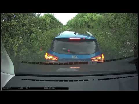 Shocking video shows blundering motorist stop on country road and reverse directly into van behind