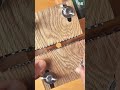 Cutting through a wooden board with a circular saw, leaving a clean straight edge