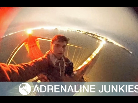 Daredevils Climb Golden Gate Bridge - This is the stomach-churning moment two teenage daredevils dice with death as they dangle from the Golden Gate Bridge.