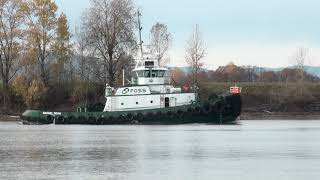 The Foss Maritime Tug Daniel Foss Heads Down The Willamette River In Portland, Oregon