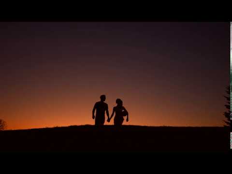 guy and girl walking holding hands loving couple walk on sunset background silhouette of loving coup
