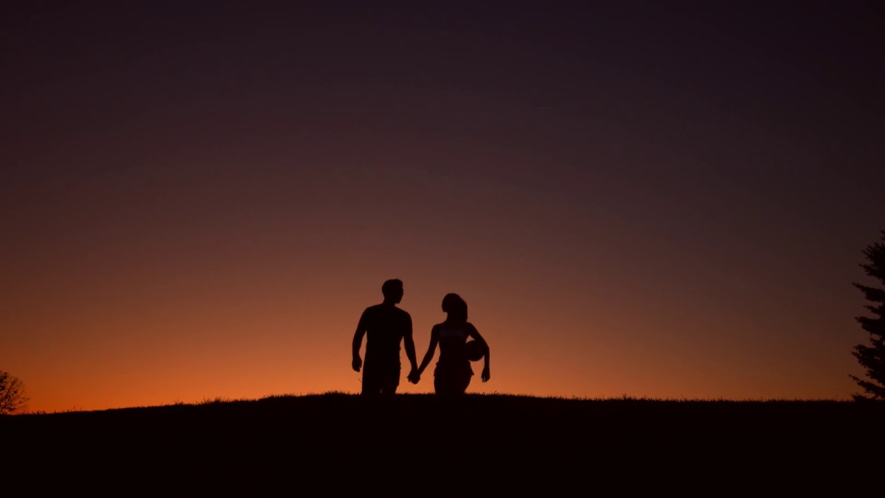 Guy And Girl Walking Holding Hands Loving Couple Walk On Sunset Background Silhouette Of Loving Coup Youtube