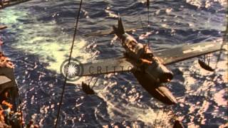 Cruiser USS Chester recovers her OS2U Kingfisher Floatplane, while underway in th...HD Stock Footage