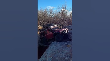 RC crawler over rock bridge