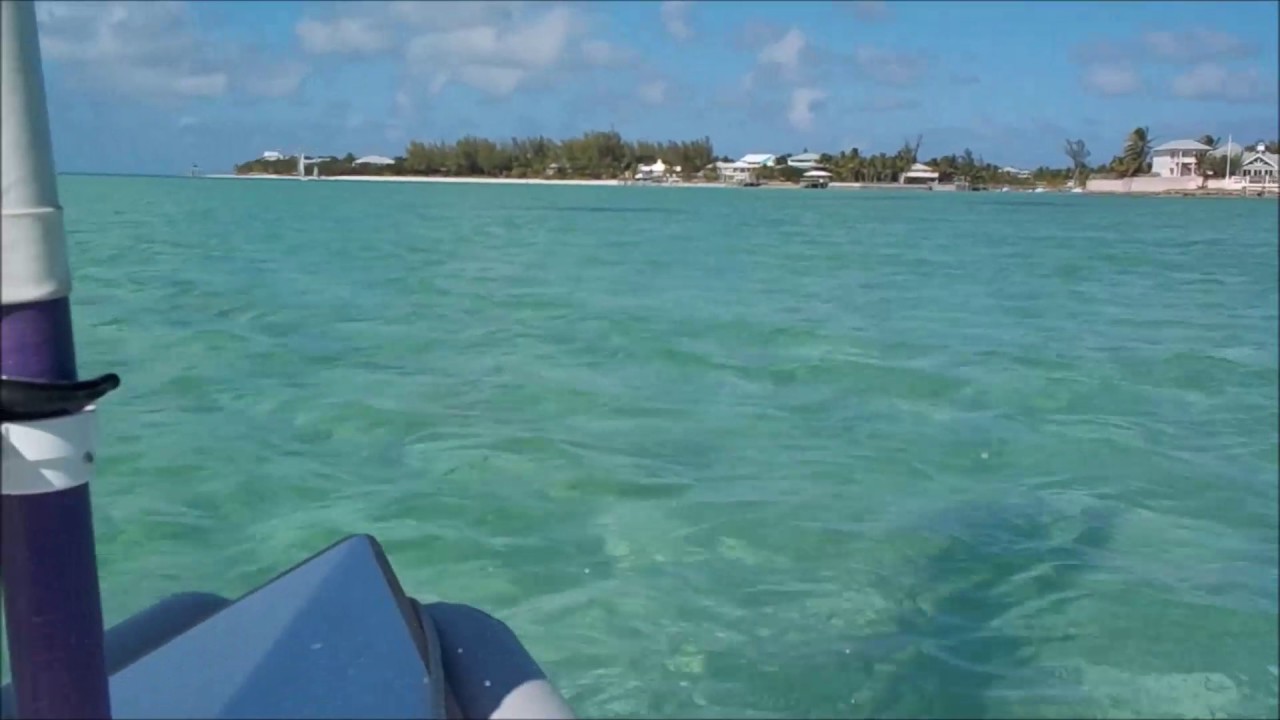 Duo dinghy sailing with friends outside Hopetown