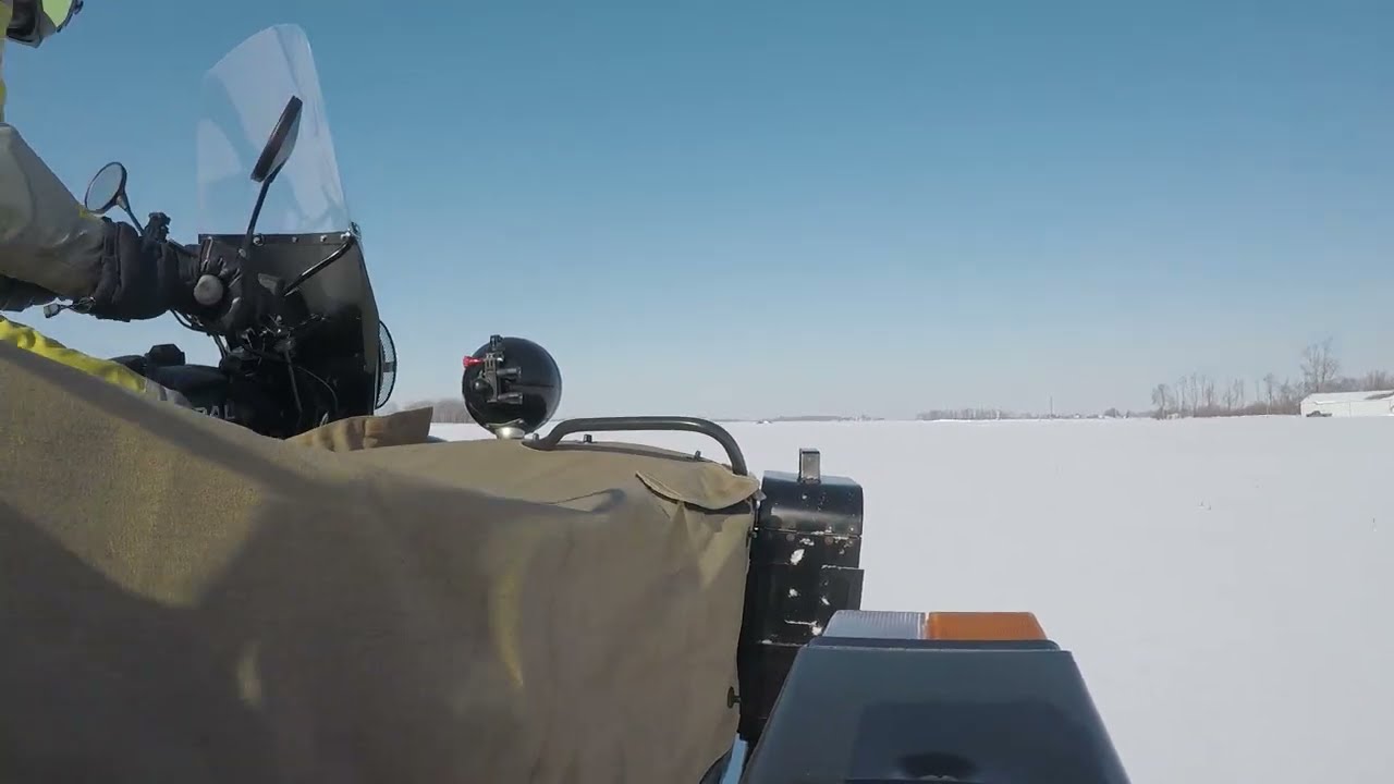 Ural 2WD Sidecar Motorcycle Snow Driving in a Field