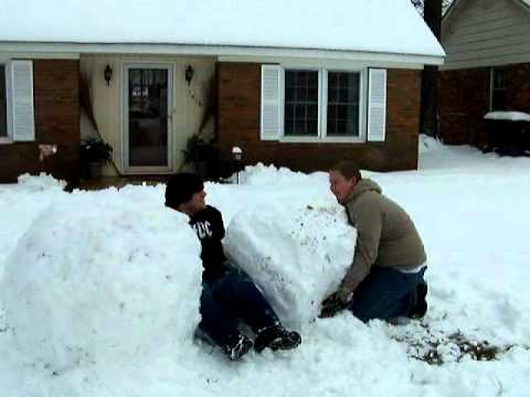 Brandon Perez and Kyle May building a snowman