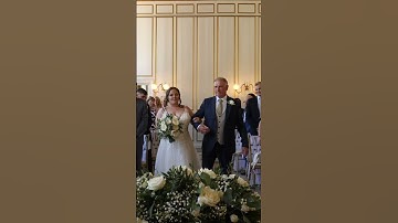 Bride walks up the aisle with her dad