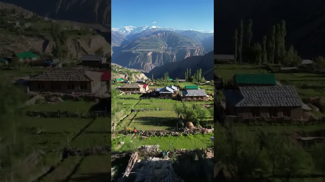 Picturesque aerial view of a himalayan village nestled amongst towering mountains and valleys