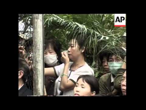 Fans Line Streets In Farewell To Leslie Cheung