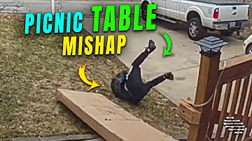 Man Falls While Moving a Picnic Table