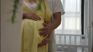 Husband hugs his pregnant wife 1