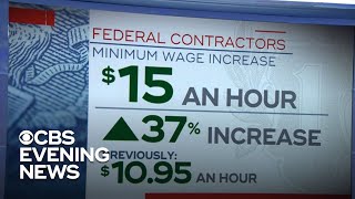 Biden raises minimum wage for federal contractors