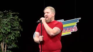Derek Lee Feltner performs stand-up comedy