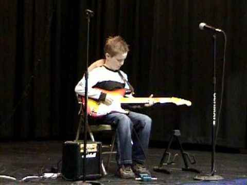 Shane playing The Star Spangle Banner on guitar at...
