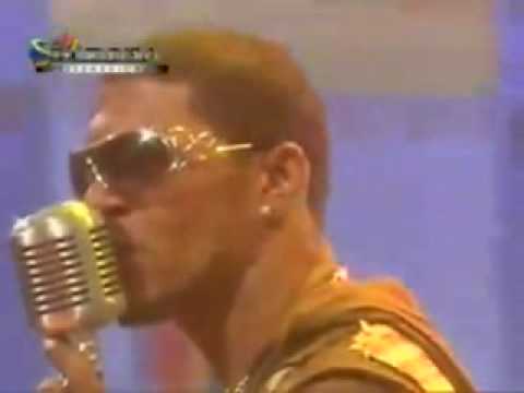 Watch the video for Por Telefono No