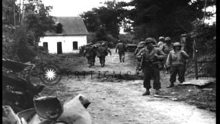 US Army medics assist a wounded soldier in St Lo France during World War 2. HD Stock Footage