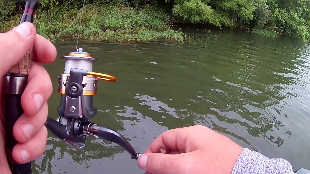 BASS FISHING LAKE SUMMER OVERCAST WINDY TOP WATER