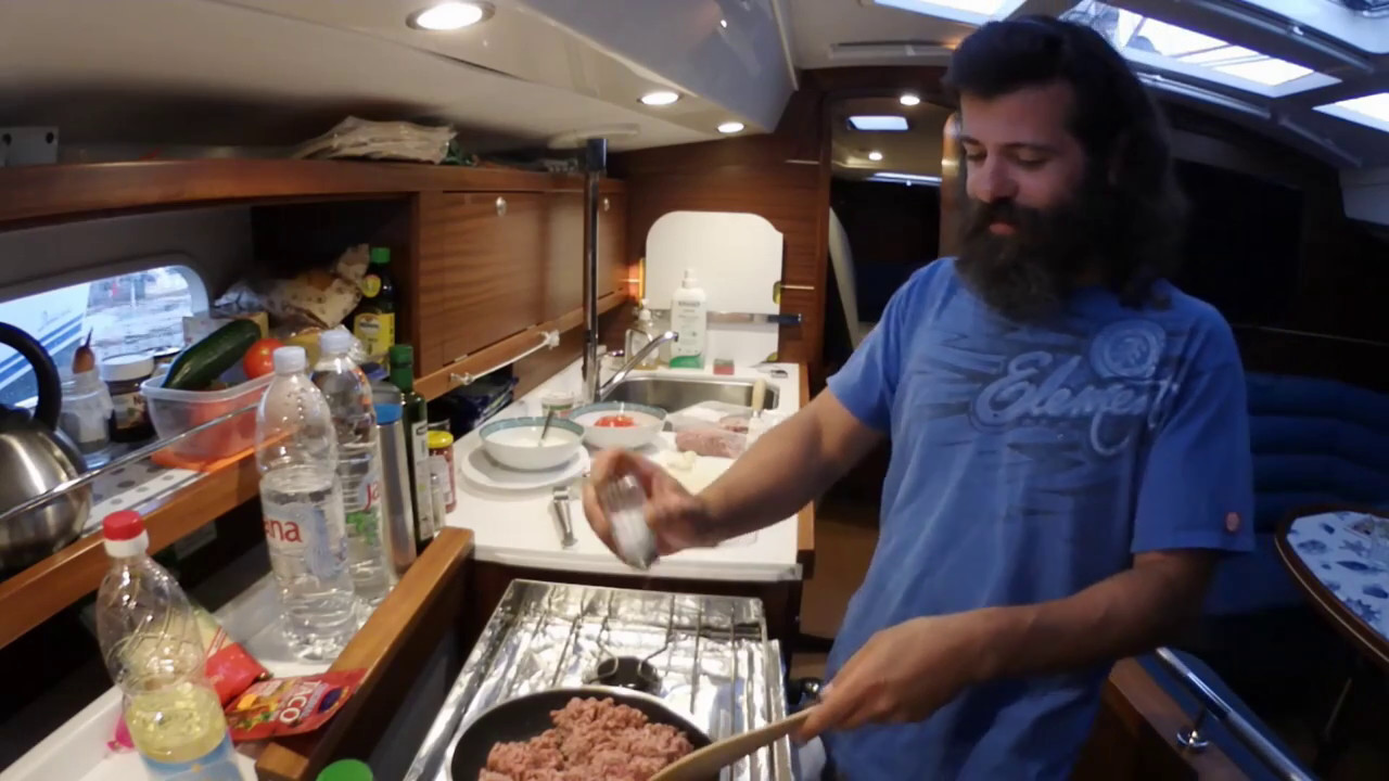 ⁣Cooking on sailboat - our friend Willi is cooking burito  // Sailng Solen