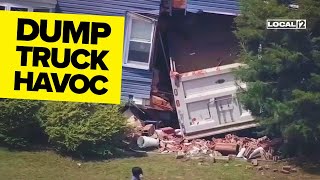 VIDEO: Dump truck takes out utility pole, crashes into home; house demolished