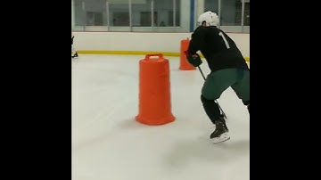 Power Skating: Pro, defenseman skating drill: backwards escapes with the puck.