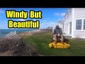 Windy Spring Day Mowing A Lawn