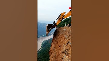 Excavator working on a cliff